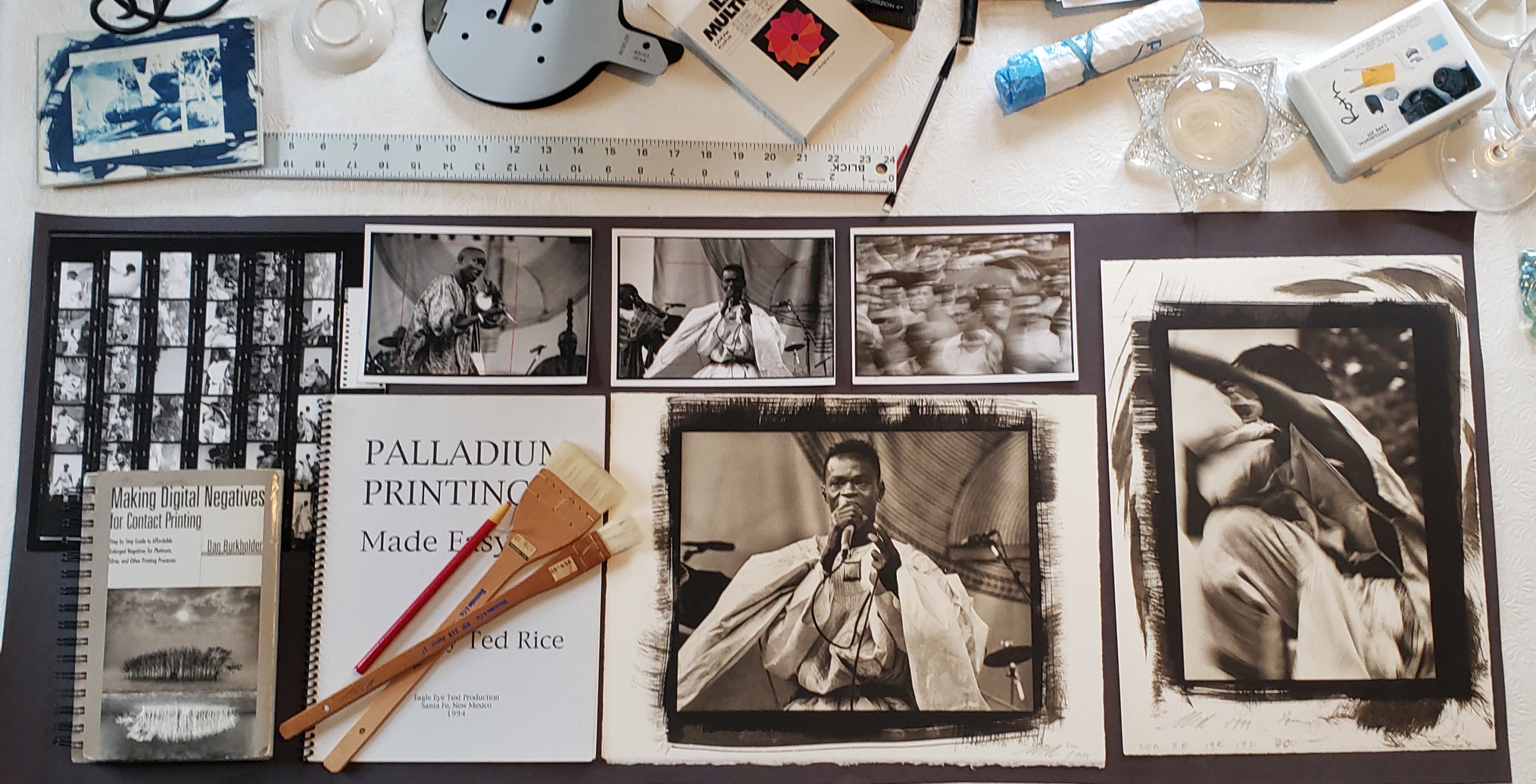 Preparing to install On Light: Reflections from the Darkroom, Photograms and Prints by Mary Cathryn Roth at SUNY Orange
